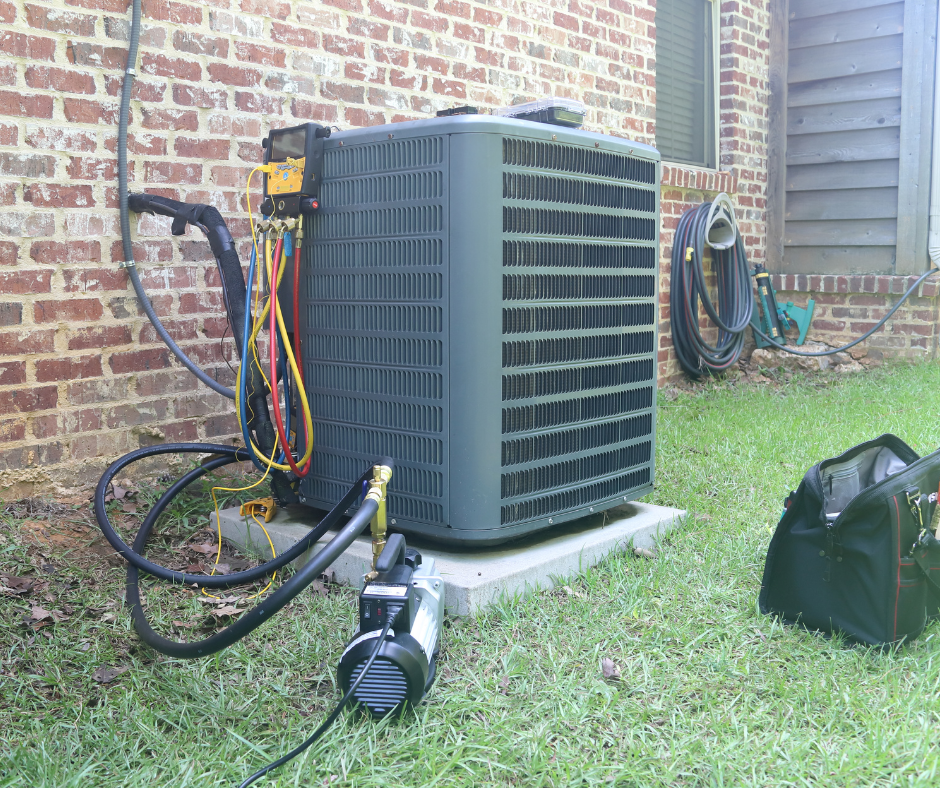 An air conditioner being worked on outside a home