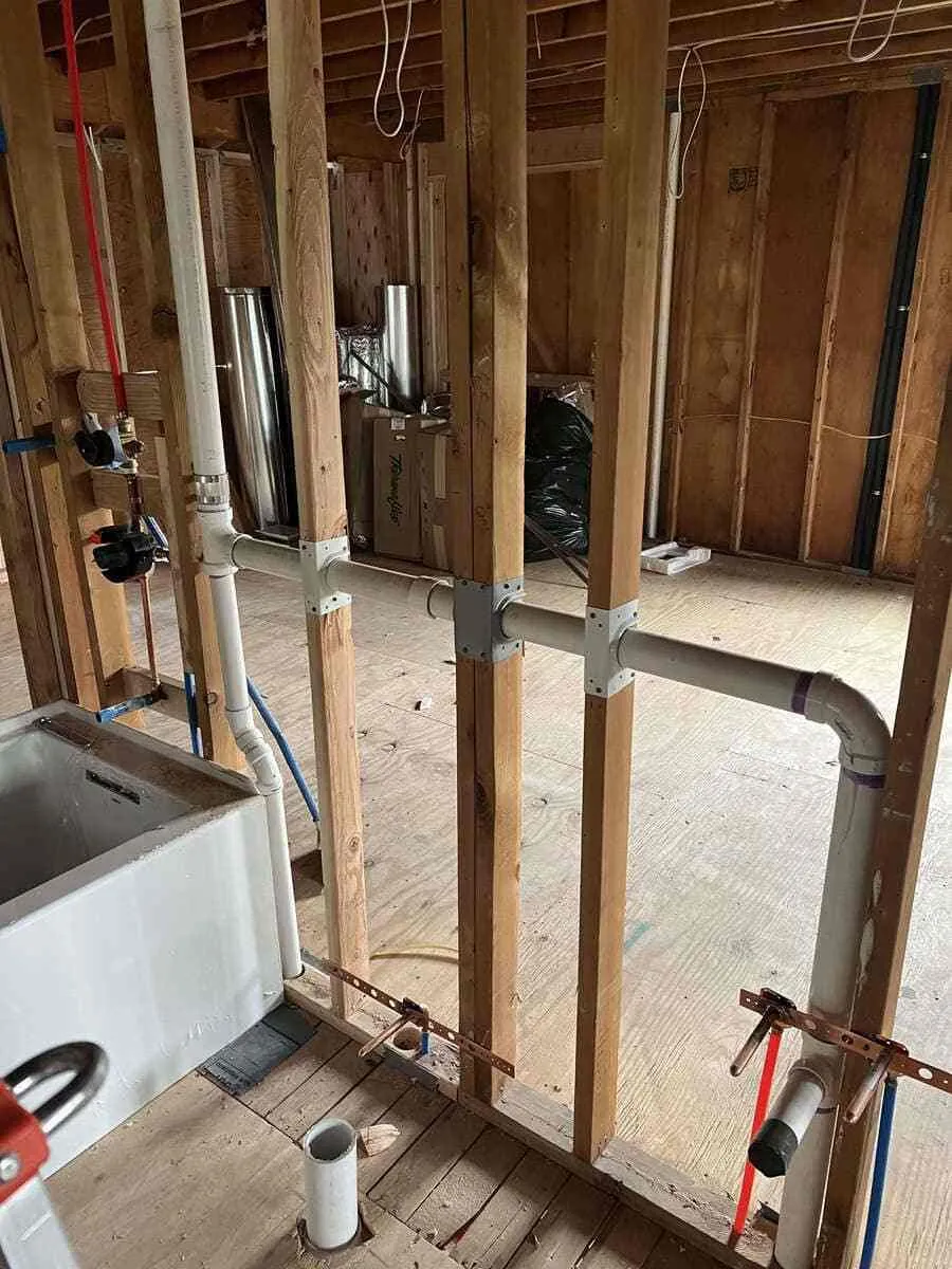 Boiler pipes and heating connections being inspected to diagnose unusual noise in Bellmore, NY. Boiler repair near me