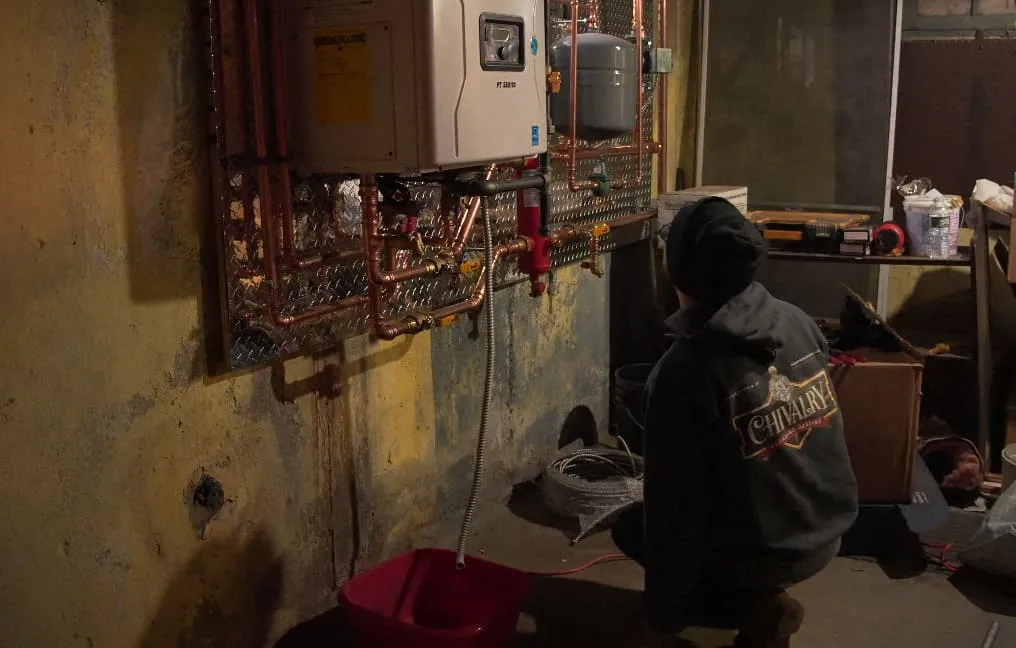 Heating system components being evaluated for recurring boiler operation problems in Plainview, NY. Boiler repair near me