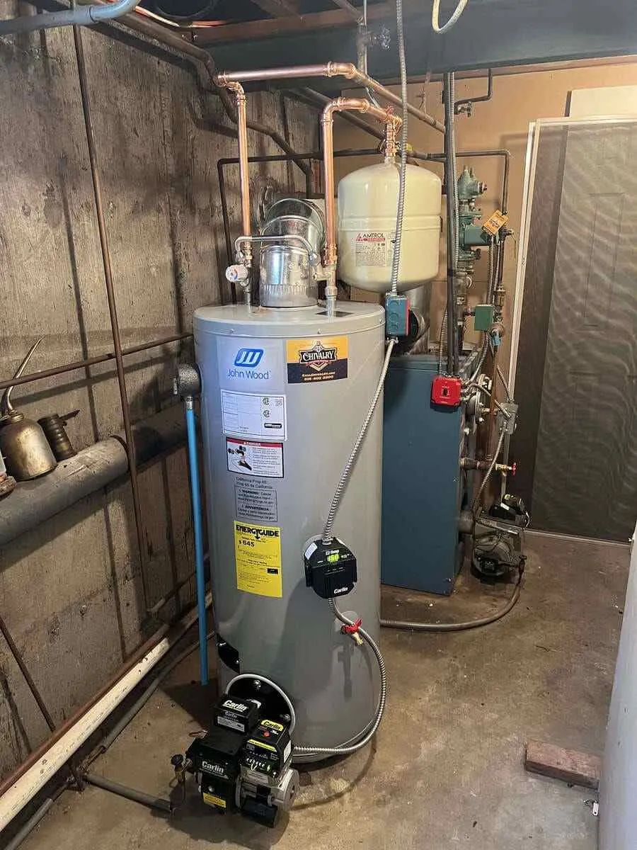 Boiler heating components being checked for banging and knocking sounds in Bellmore, NY.