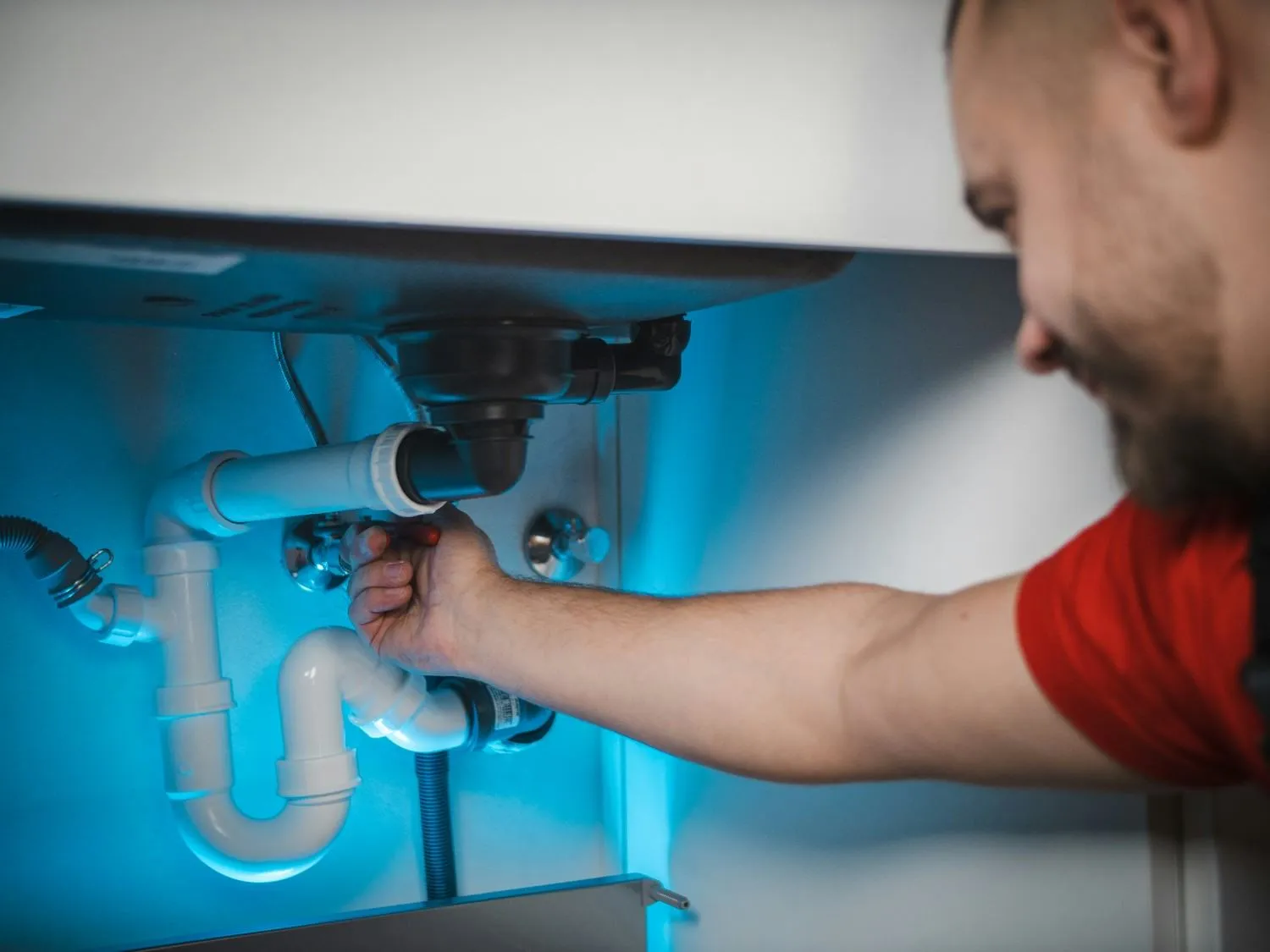 Plumbing supply line and fixture connection being checked in a Nassau County home. Plumber near me