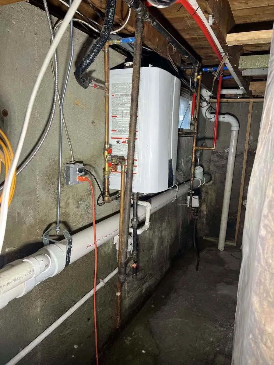 Residential water lines and fixture connections being inspected for plumbing concerns in Melville, NY. Plumber near me